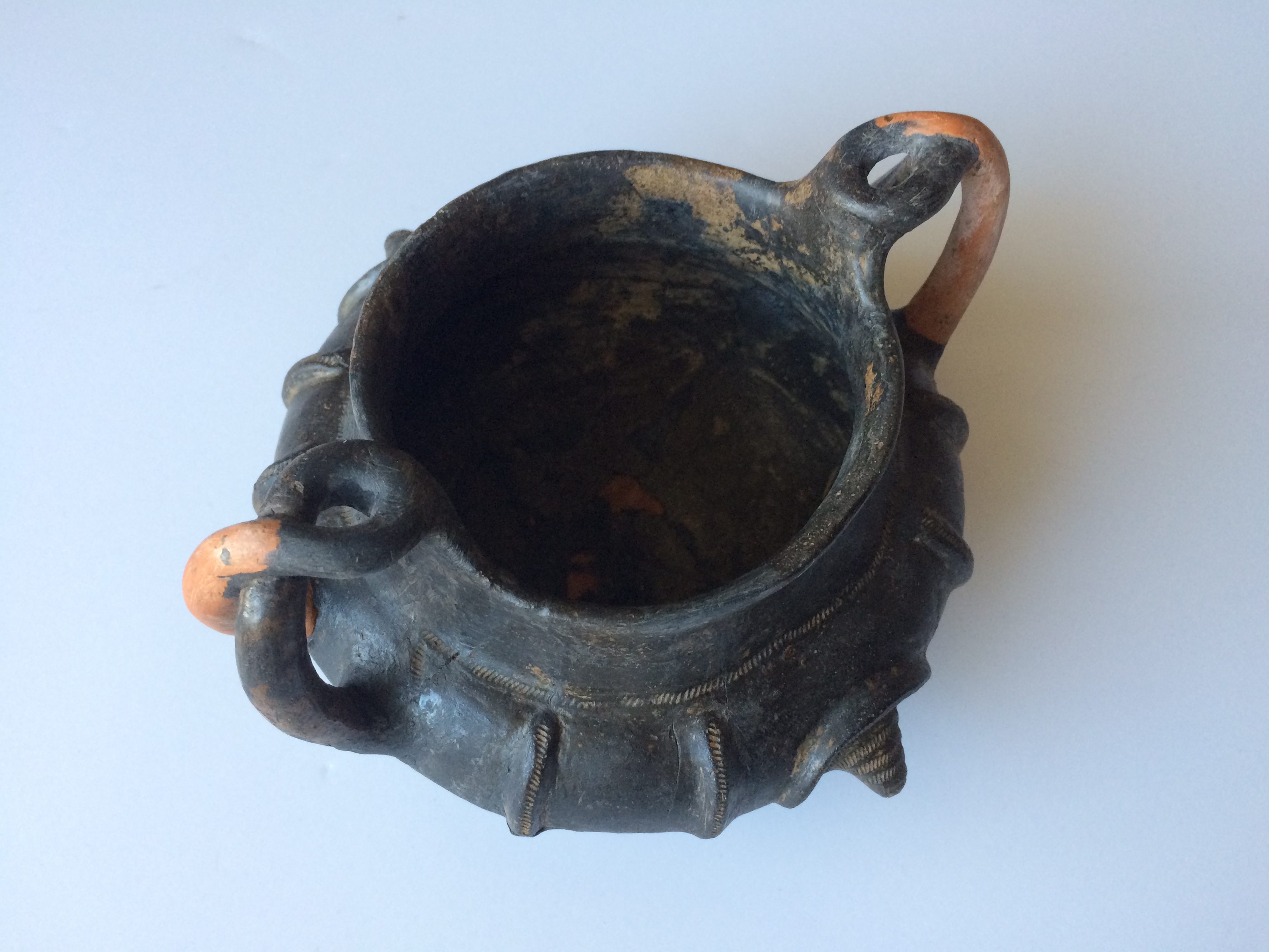 Etruscan pottery during conservation with new sculpted handles
