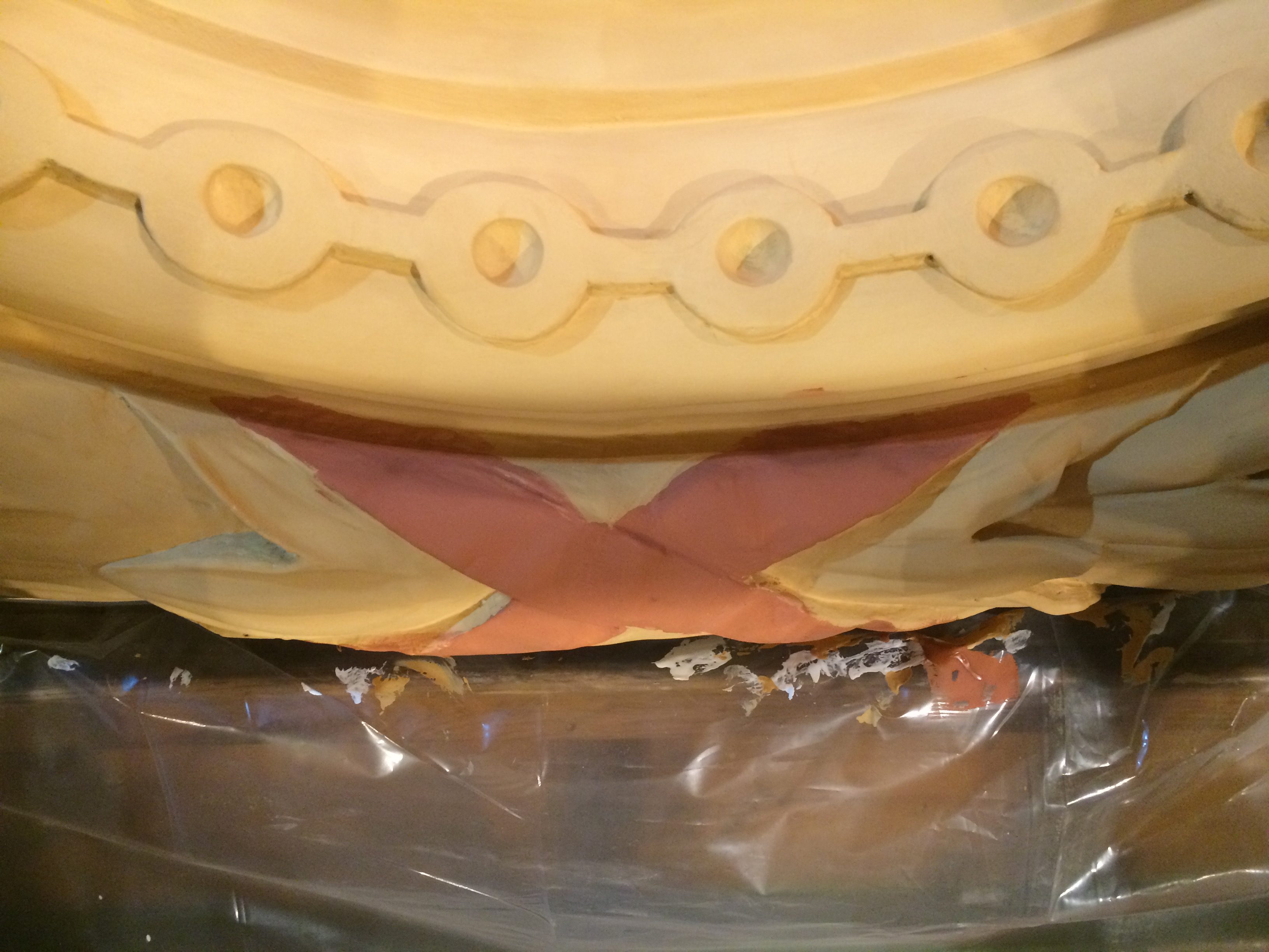 Wooden ornament during gilding restoration and surface preparation for gilding