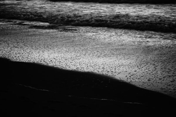 Black and white image of a beach