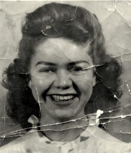 Damaged portrait before digital restoration.